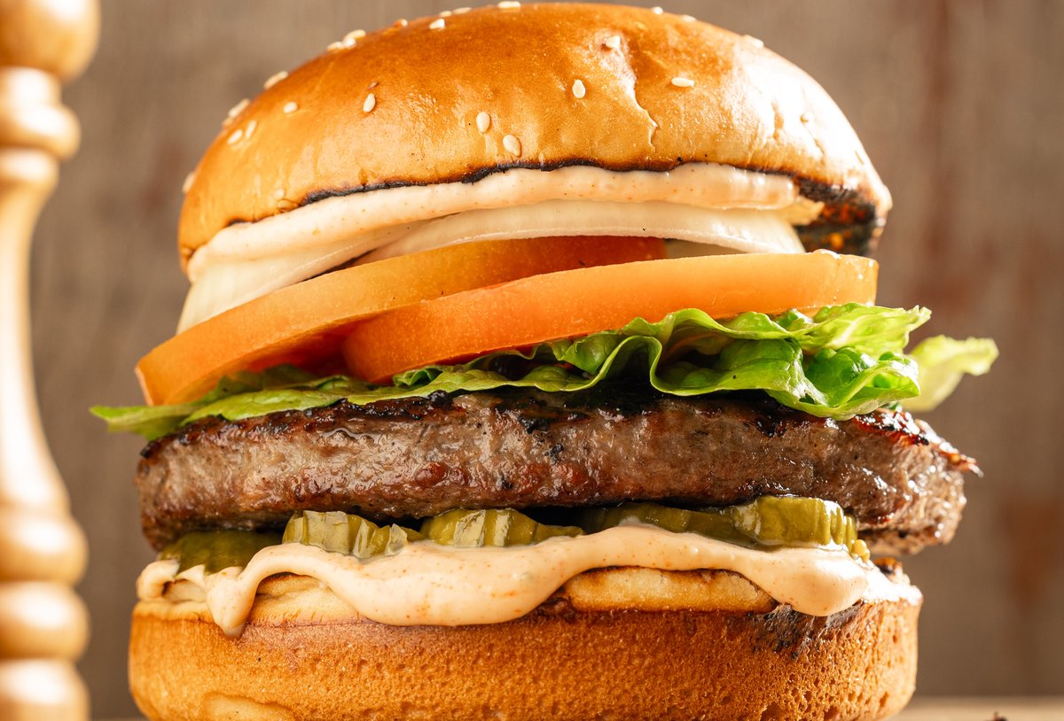 Classic burger on a sesame bun at Shimmy's HaMirpeset